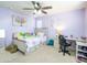 A charming bedroom boasts a comfortable bed, desk, and carpet flooring at 761 W Desert Hollow Dr, San Tan Valley, AZ 85143