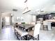 Open-concept dining area seamlessly connects the kitchen, offering a spacious layout perfect for entertaining at 761 W Desert Hollow Dr, San Tan Valley, AZ 85143