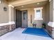 Inviting entryway with a decorative rug, seating, a welcome sign and a security door at 761 W Desert Hollow Dr, San Tan Valley, AZ 85143