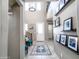 Inviting two-story entryway with a chandelier, artwork, and tile flooring at 761 W Desert Hollow Dr, San Tan Valley, AZ 85143