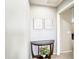 This entryway features a console table, wall art, and open doorway leading to another room at 761 W Desert Hollow Dr, San Tan Valley, AZ 85143