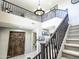 A grand foyer with beautiful staircase, elegant lighting, and open, airy feel at 761 W Desert Hollow Dr, San Tan Valley, AZ 85143