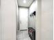 Hallway with convenient shoe storage and wall-mounted hat rack at 761 W Desert Hollow Dr, San Tan Valley, AZ 85143