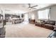 Open-concept living room flows into kitchen, featuring a large island with barstool seating at 761 W Desert Hollow Dr, San Tan Valley, AZ 85143