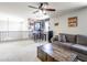 A cozy loft featuring a comfortable seating area with couch and bar table at 761 W Desert Hollow Dr, San Tan Valley, AZ 85143