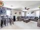 A spacious loft with a large sectional sofa, bar table, and carpet flooring at 761 W Desert Hollow Dr, San Tan Valley, AZ 85143