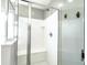 This shower has a built-in seat and shower head plus a clear glass enclosure at 761 W Desert Hollow Dr, San Tan Valley, AZ 85143