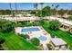 Aerial view of a community pool, hot tub, and well-maintained landscaping at 7707 E Park View Dr, Mesa, AZ 85208