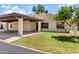 Charming single-story home with a covered carport and well-manicured front lawn at 7707 E Park View Dr, Mesa, AZ 85208