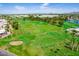 Scenic golf course featuring lush green fairways, mature trees, and sand traps at 7707 E Park View Dr, Mesa, AZ 85208