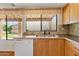 Kitchen view highlighting the sink, cabinetry, and ample natural light from the window at 7707 E Park View Dr, Mesa, AZ 85208