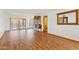 Spacious living room with hardwood floors, stylish decor, and access to the backyard at 7707 E Park View Dr, Mesa, AZ 85208
