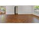 Open living area featuring hardwood floors and a view into the adjacent kitchen at 7707 E Park View Dr, Mesa, AZ 85208