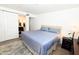 Comfortable bedroom with a plush rug and an ensuite bathroom featuring a sliding barn door at 7777 E Main St # 227, Scottsdale, AZ 85251