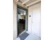 Inviting doorway leads into a kitchen with a breakfast bar, featuring sleek chairs for casual dining and modern design at 7777 E Main St # 227, Scottsdale, AZ 85251