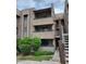 Exterior view of a three-story condo building with well-maintained landscaping, showing the building's charming facade at 7777 E Main St # 227, Scottsdale, AZ 85251