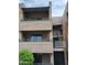 Exterior view of a three-story condo building with well-maintained landscaping and charming facade at 7777 E Main St # 227, Scottsdale, AZ 85251