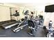 This home gym features a treadmill, television, elliptical machine, and recumbent bike at 7777 E Main St # 227, Scottsdale, AZ 85251