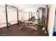 This home gym has a squat rack, multi-station, bench, and other exercise accessories at 7777 E Main St # 227, Scottsdale, AZ 85251