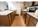Modern kitchen featuring stainless steel appliances, granite countertops, and ample cabinet space for convenient storage at 7777 E Main St # 227, Scottsdale, AZ 85251