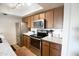 A modern kitchen features stainless steel appliances, granite countertops, and updated cabinets and fixtures at 7777 E Main St # 227, Scottsdale, AZ 85251