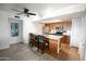 Bright kitchen featuring a breakfast bar with seating, stainless steel appliances, and modern finishes for a stylish cooking space at 7777 E Main St # 227, Scottsdale, AZ 85251