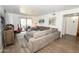 Cozy living room with plush sectional sofa, sliding glass doors to balcony, and neutral tones for comfortable living at 7777 E Main St # 227, Scottsdale, AZ 85251