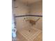 Accessible bathroom featuring tiled shower, grab bars, and shower seat at 7914 E Bonita Dr, Scottsdale, AZ 85250