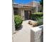 Inviting front entrance with desert landscaping, lush bushes, and a private courtyard at 7914 E Bonita Dr, Scottsdale, AZ 85250