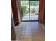 Kitchen's tile floor leads to sliding glass doors with views of landscaped outdoor space at 7914 E Bonita Dr, Scottsdale, AZ 85250