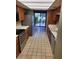 Well-lit kitchen features stainless appliances, tile flooring, and a sliding glass door to the outside at 7914 E Bonita Dr, Scottsdale, AZ 85250