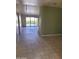 Bright living room featuring tile flooring and sliding glass doors to the exterior at 7914 E Bonita Dr, Scottsdale, AZ 85250