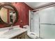 Bathroom featuring a sink, toilet, and walk-in shower with glass doors at 8103 E Southern Ave # 119, Mesa, AZ 85209