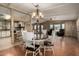 Bright dining room featuring hardwood floors, pendant lighting and an open floor plan at 8103 E Southern Ave # 119, Mesa, AZ 85209