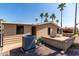 Back exterior of home featuring an air conditioner, palm trees, and patio at 8103 E Southern Ave # 119, Mesa, AZ 85209