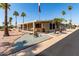 Charming home featuring a long porch, complemented by palm trees and xeriscaping for a low-maintenance yard at 8103 E Southern Ave # 119, Mesa, AZ 85209