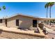 Back exterior of home featuring palm trees and a patio at 8103 E Southern Ave # 119, Mesa, AZ 85209