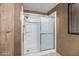 Shower with glass sliding doors and a chrome shower head at 8103 E Southern Ave # 119, Mesa, AZ 85209