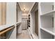 Large walk-in closet with built-in shelving and ample storage space at 8103 E Southern Ave # 119, Mesa, AZ 85209