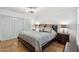 This is a bedroom with a modern ceiling fan, closet, and tiled floors at 8787 E Mountain View Rd # 1100, Scottsdale, AZ 85258