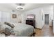 This bedroom includes tiled floors, a ceiling fan, and a bathroom with a tiled shower at 8787 E Mountain View Rd # 1100, Scottsdale, AZ 85258
