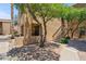 Exterior view of a well-maintained condo building with desert landscaping and outdoor staircase at 8787 E Mountain View Rd # 1100, Scottsdale, AZ 85258
