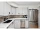 Modern kitchen with stainless steel appliances and sleek white cabinetry at 8787 E Mountain View Rd # 1100, Scottsdale, AZ 85258