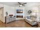 Bright living room featuring a modern fireplace, mounted TV, and comfortable seating with stylish decor at 8787 E Mountain View Rd # 1100, Scottsdale, AZ 85258