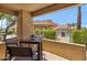 Relaxing patio overlooking the community pool area, perfect for enjoying the outdoors at 8787 E Mountain View Rd # 1100, Scottsdale, AZ 85258