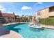 Community pool with spa and lounge area, surrounded by well-maintained landscaping at 8787 E Mountain View Rd # 1100, Scottsdale, AZ 85258