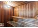 Relaxing wooden sauna room with built-in benches for ultimate comfort and wellness at 8787 E Mountain View Rd # 1100, Scottsdale, AZ 85258