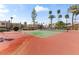 Community tennis court surrounded by beautiful landscaping and sunny skies at 8787 E Mountain View Rd # 1100, Scottsdale, AZ 85258