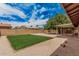 Backyard features a spacious yard, shaded patio, and gravel accents at 9414 N 50Th Dr, Glendale, AZ 85302