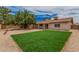 A large tree provides shade in this home's backyard, featuring gravel and a patch of grass at 9414 N 50Th Dr, Glendale, AZ 85302
